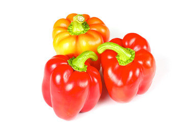 Orange and red pepper isolated on white