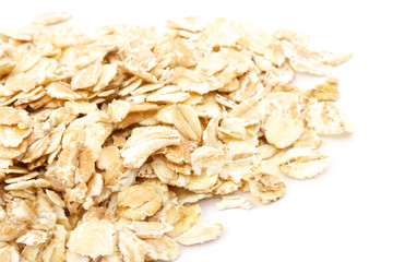Heap of dry rolled oats isolated