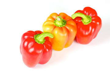 Orange and red pepper isolated on white