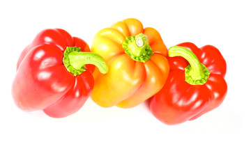 Orange and red pepper isolated on white