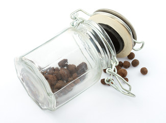 a pile of peppercorns in the bottle