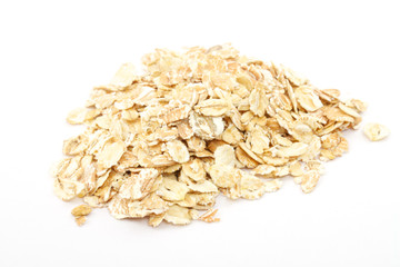 Heap of dry rolled oats isolated
