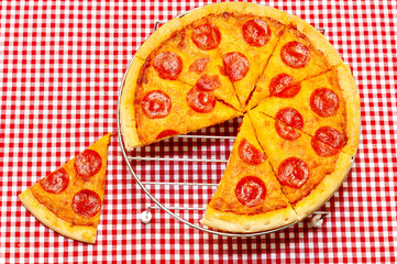 Whole Pepperoni Pizza with Slice Removed