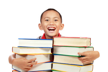 child smiling with book on his chest