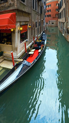Fototapeta na wymiar Venetian view with parked gondola