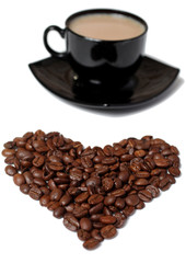 Cup of coffee and heart from coffee grains