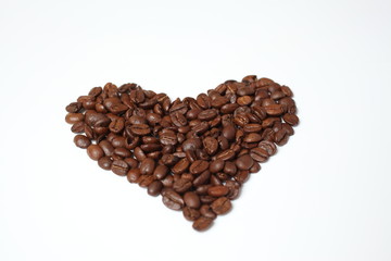 Heart from coffee grains on a white background