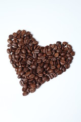 Heart from coffee grains on a white background