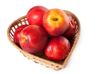 peaches on a white background in the basket