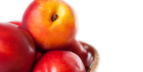 peaches on a white background in the basket