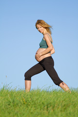 pregnant woman on meadow