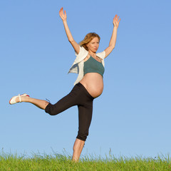 pregnant woman on meadow