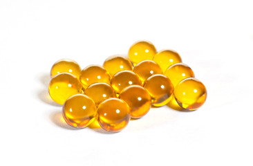 Pills with vitamin E on the white white background