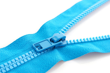 Blue zipper closeup isolated on white
