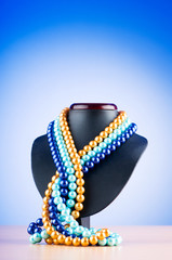 Pearl necklace against gradient background