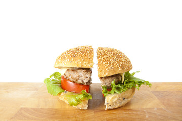 half beef, two pieces beef hamburger sesame bread.