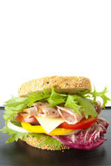 on diet, ham sandwich with fresh vegetable sesame bread.