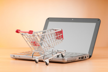 Internet online shopping concept with computer and cart