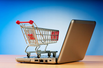 Internet online shopping concept with computer and cart