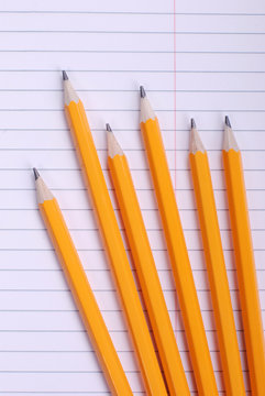 pencils on notebook