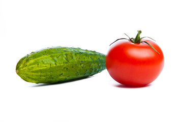Tomatoes and cucumber isolated on white