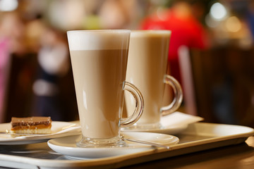 coffee latte in two tall glasses