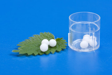 Homeopathic pills on Urtica Urens leaf