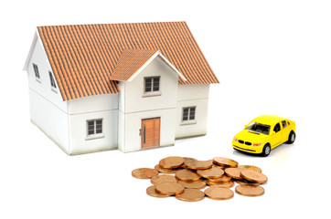 Toy car and house with coins