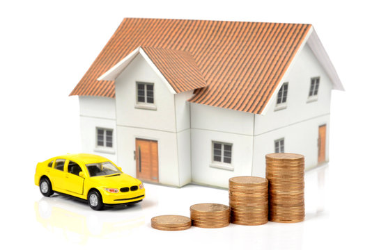 Toy car and house with coins