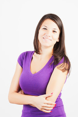 Fototapeta premium Portrait of gorgeous young woman standing with hands folded