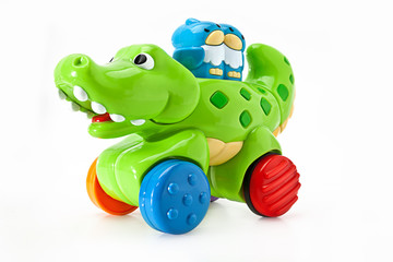 An aligator and owl children's toy on wheels
