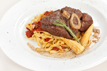 tasty steak with pasta