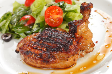 Roasted chicken leg with salad