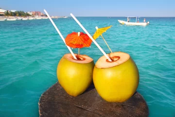 Fotobehang coconut coktails in caribbean on wood pier © lunamarina