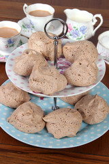Chocolate meringues on cake stand