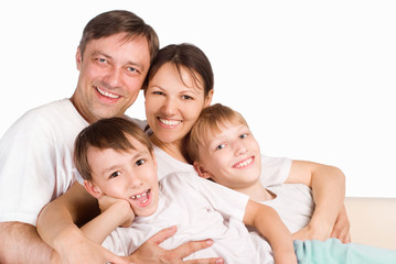 Fototapeta premium happy family on a white