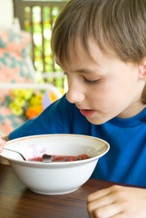 young boy eating