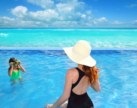 blue swimming pool caribbean view mother daughter