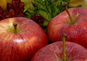 Three Autumn Apples With Fall Leaf Background