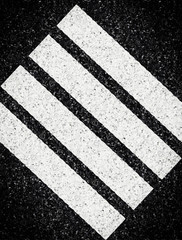 Abstract stripes on asphalt background.