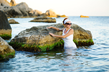 Beautiful woman splashing in the sea