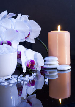 sea salt with candle and orchid