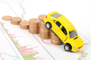 Toy car and financial graph