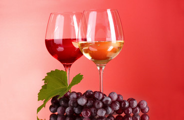 Wine bottle and glass on red background