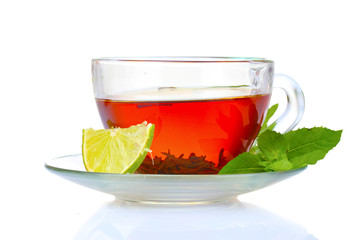 black tea in cup, mint and lime isolated on white