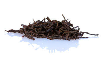 dry black tea leaves isolated on white