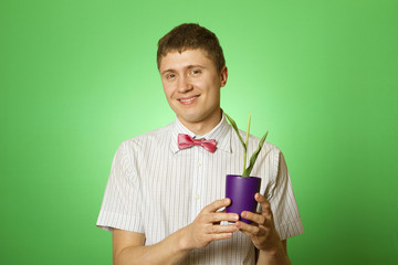 Man observes cultivation of young plants