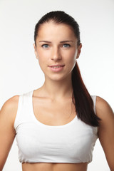 Young happy woman in sports wear