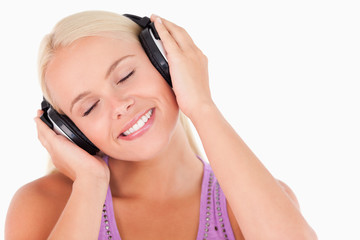 Fototapeta premium Relaxed woman listening to music