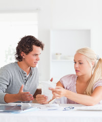 Fototapeta premium Couple doing their accounts